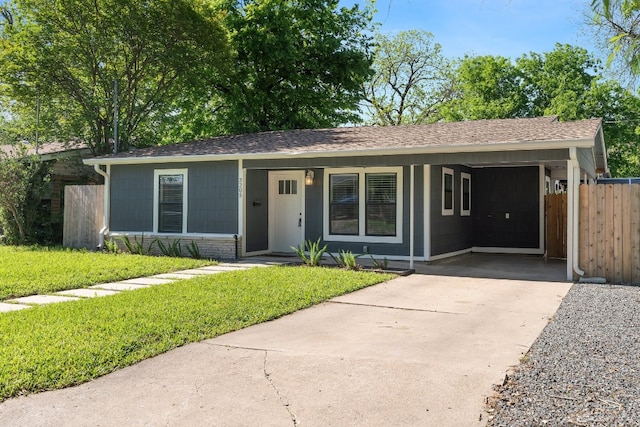 single story home with a front lawn, a carport, and covered porch