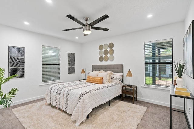 carpeted bedroom with ceiling fan