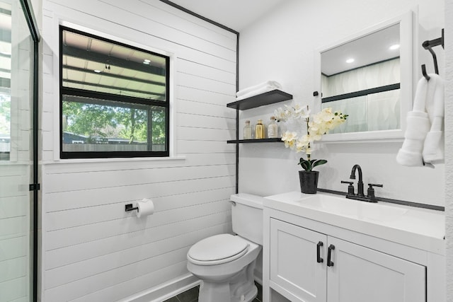 bathroom featuring large vanity and toilet