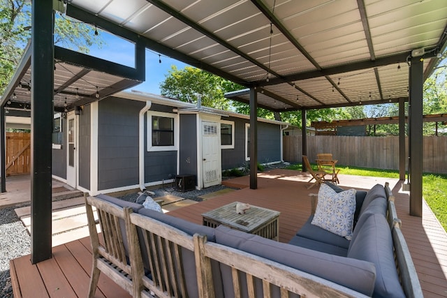 wooden terrace featuring an outdoor living space