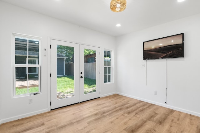 entryway featuring french doors and light hardwood / wood-style floors