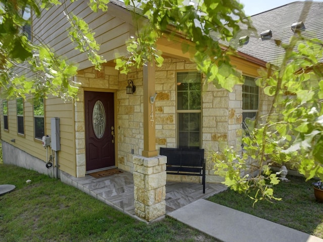 view of exterior entry with stone siding