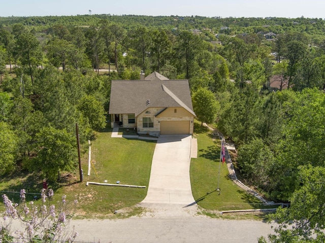 bird's eye view featuring a wooded view