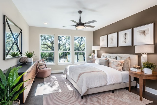 bedroom with hardwood / wood-style flooring and ceiling fan