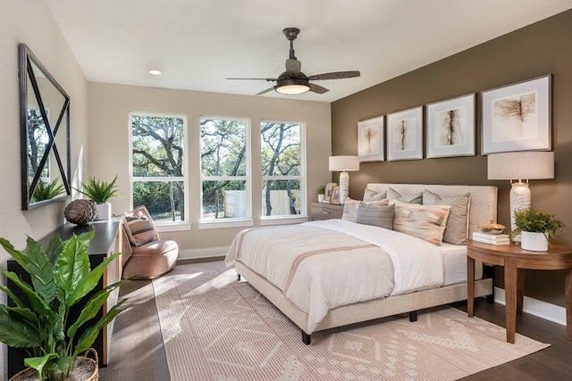 bedroom featuring hardwood / wood-style floors and ceiling fan