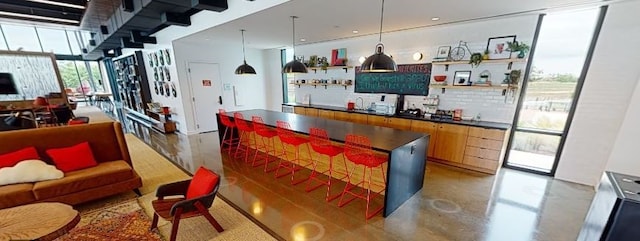 kitchen with concrete flooring and decorative light fixtures