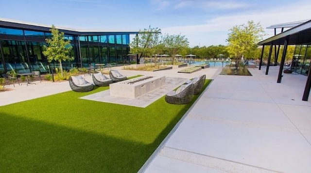 surrounding community featuring a patio area and a lawn