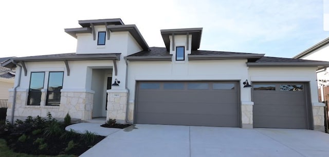 prairie-style house featuring a garage