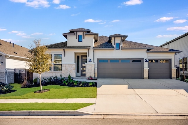 prairie-style home with a garage, central air condition unit, and a front lawn