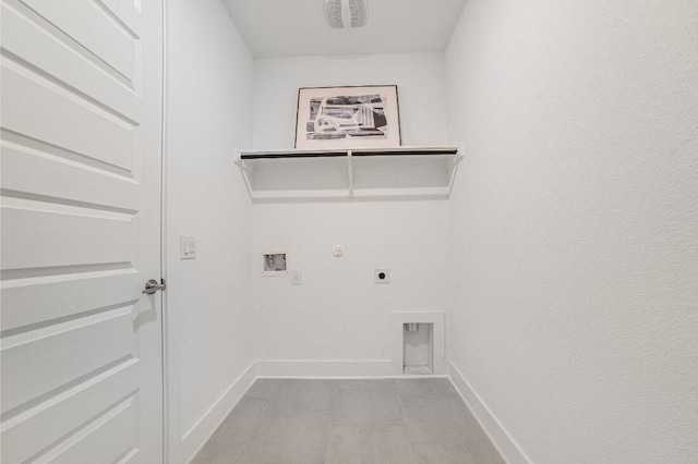 laundry room with gas dryer hookup, hookup for an electric dryer, light tile patterned flooring, and hookup for a washing machine