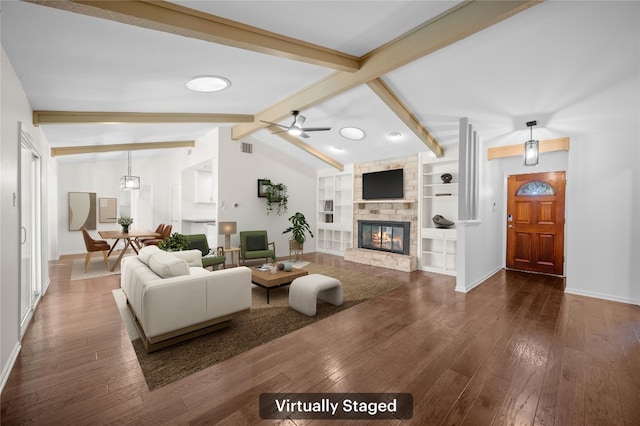 living room with built in shelves, ceiling fan, dark wood-type flooring, and lofted ceiling with beams