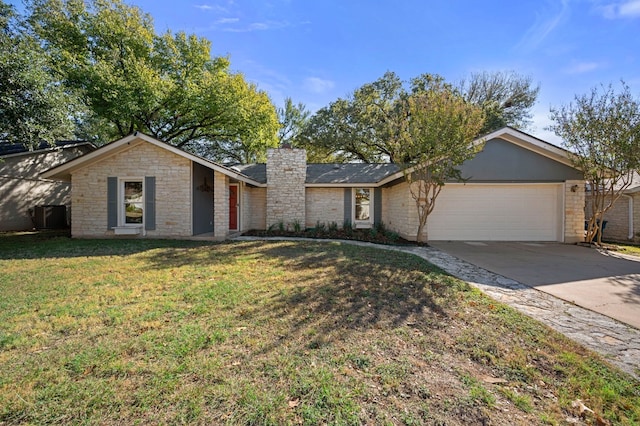 single story home with a garage and a front lawn