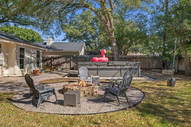 view of yard featuring an outdoor fire pit