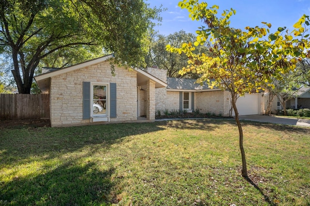 single story home with a front yard and a garage