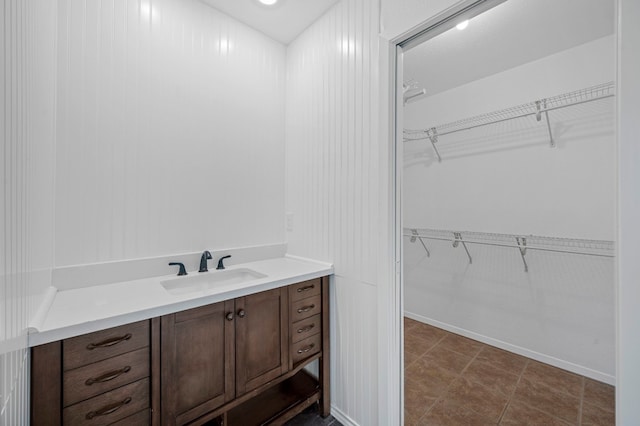 bathroom with tile patterned flooring and vanity