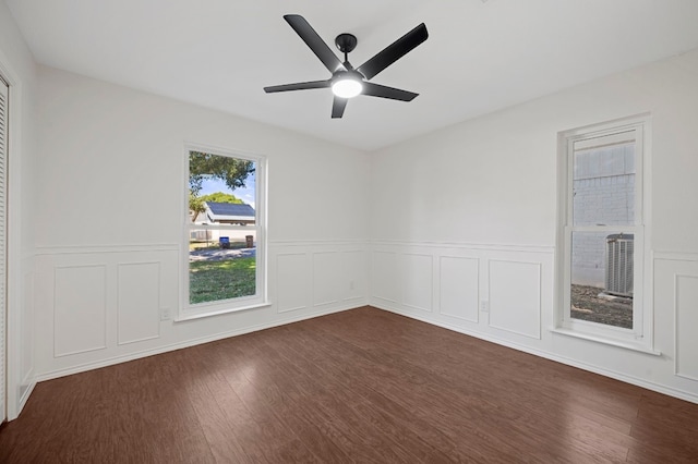 spare room with ceiling fan and dark wood-type flooring