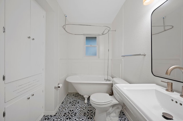 full bathroom with tile patterned flooring, toilet, shower / bath combination, and sink