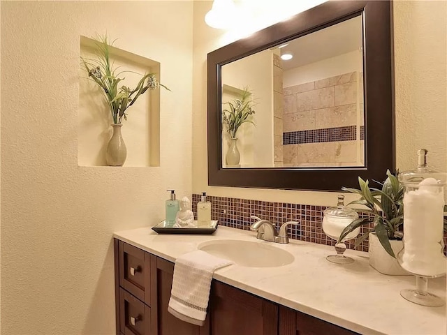 bathroom with backsplash and large vanity