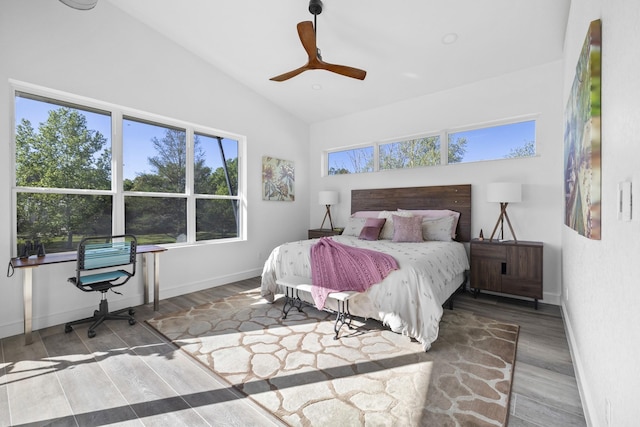 bedroom featuring ceiling fan, lofted ceiling, and hardwood / wood-style floors