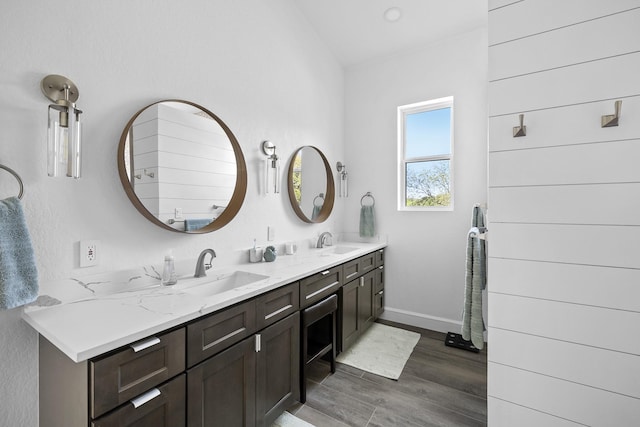 bathroom with hardwood / wood-style floors and vanity