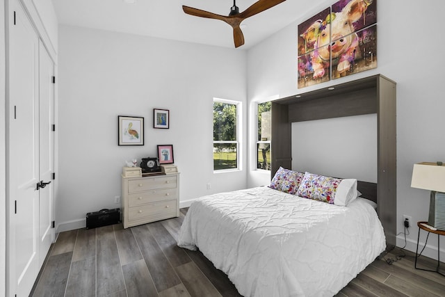 bedroom featuring ceiling fan and dark hardwood / wood-style flooring