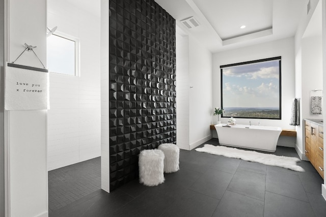 bathroom featuring a wealth of natural light, tile flooring, and vanity