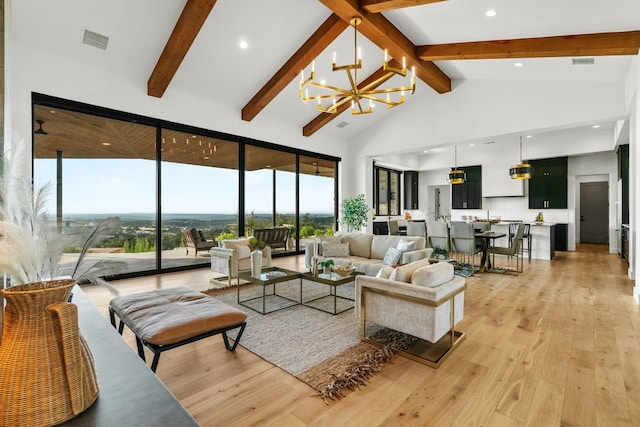 living room featuring high vaulted ceiling, an inviting chandelier, light wood-type flooring, and beam ceiling