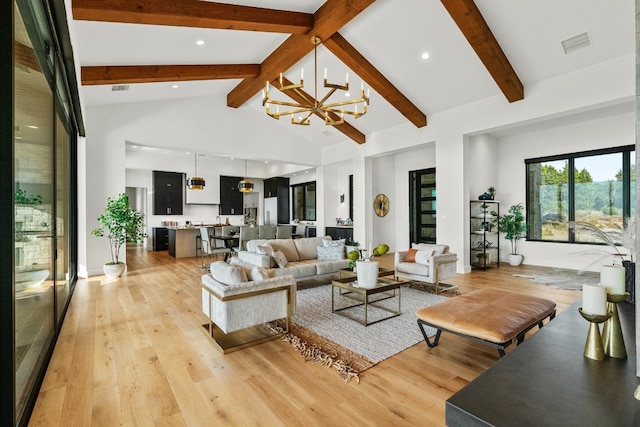 living room with high vaulted ceiling, a notable chandelier, light wood-type flooring, and beam ceiling