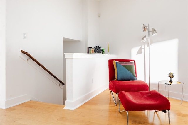 sitting room with hardwood / wood-style flooring