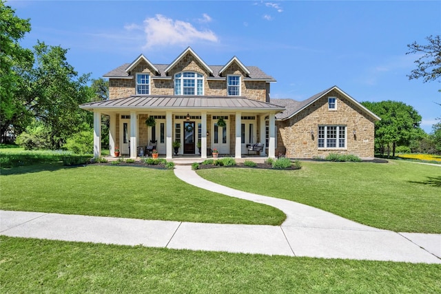 craftsman inspired home with covered porch and a front lawn