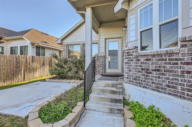 entrance to property featuring a patio