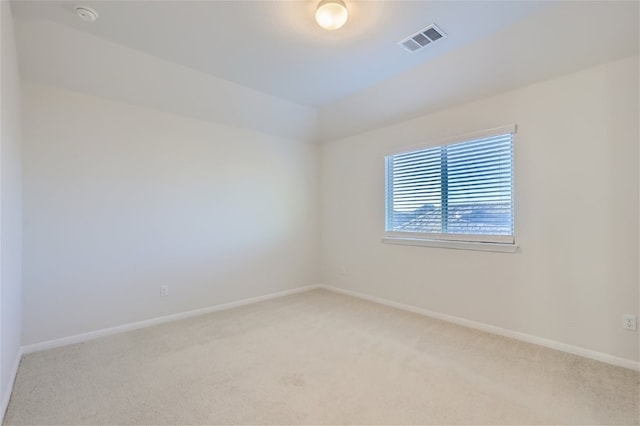 empty room featuring light carpet