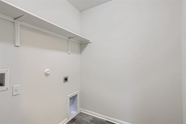 washroom with electric dryer hookup, hardwood / wood-style floors, washer hookup, and gas dryer hookup