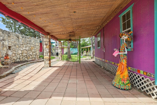 view of patio featuring ceiling fan