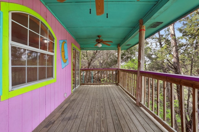 wooden terrace featuring ceiling fan