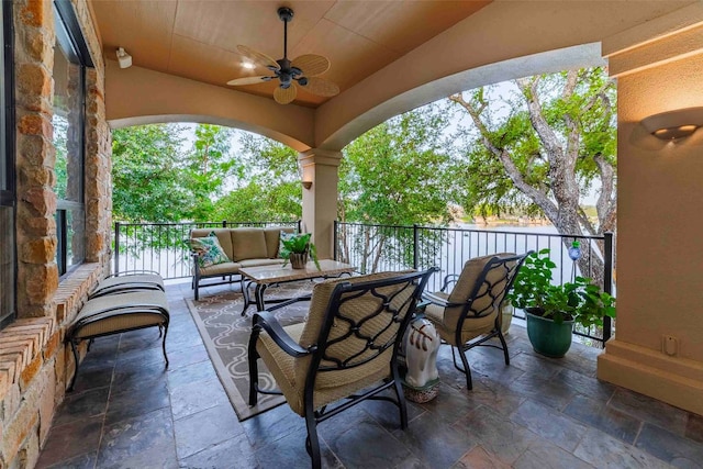 view of patio featuring ceiling fan and outdoor lounge area