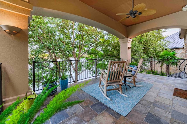 view of patio featuring ceiling fan