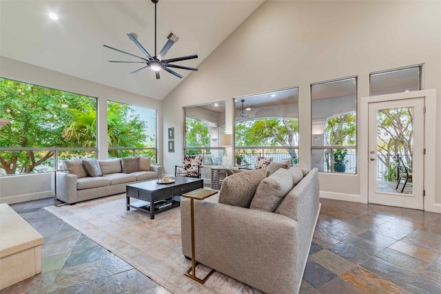 living room featuring ceiling fan, high vaulted ceiling, and tile patterned flooring