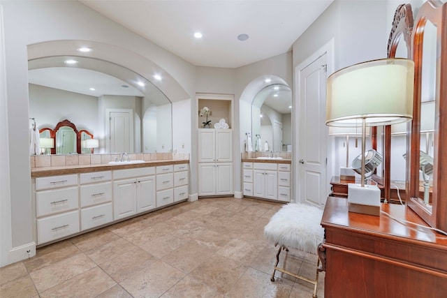 bathroom with tile patterned floors and vanity