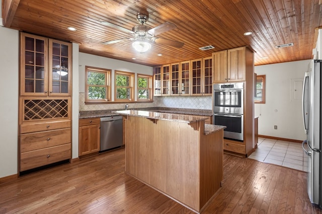 kitchen featuring appliances with stainless steel finishes, wooden ceiling, ceiling fan, and light wood-type flooring