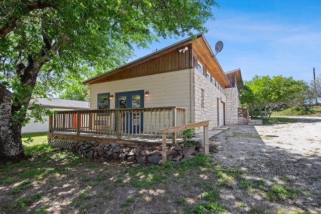 rear view of property with a deck