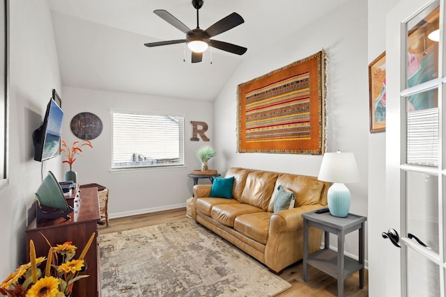 living room with ceiling fan, lofted ceiling, light hardwood / wood-style flooring, and french doors