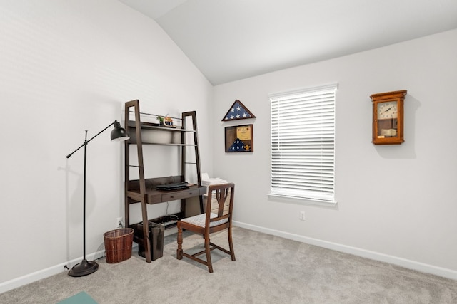 office area with lofted ceiling and light colored carpet