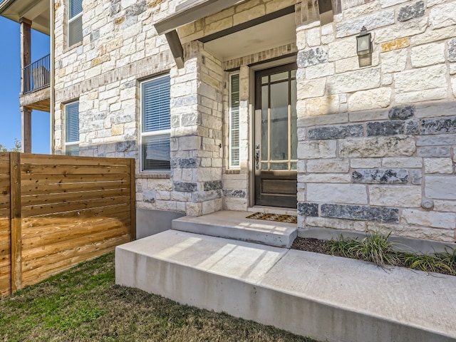 entrance to property featuring a balcony