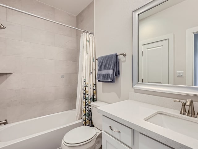 full bathroom with shower / bath combo, oversized vanity, and toilet