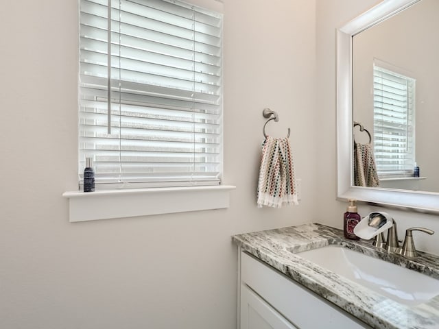 bathroom with vanity with extensive cabinet space