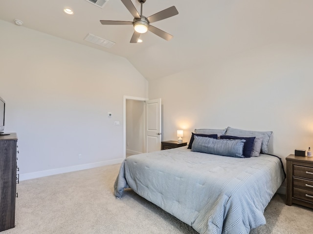 carpeted bedroom with ceiling fan and high vaulted ceiling