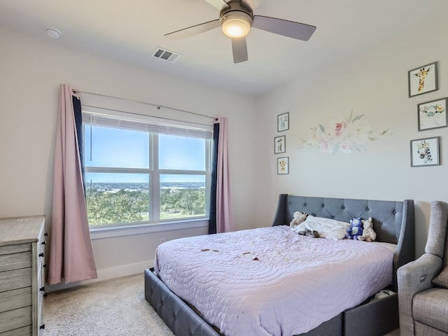 bedroom with light colored carpet and ceiling fan