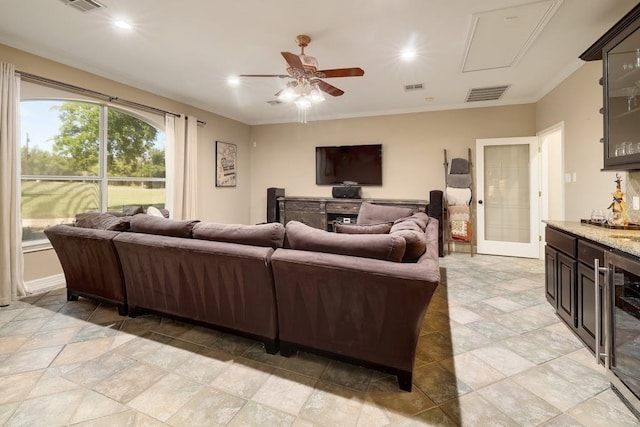 tiled living room featuring ceiling fan