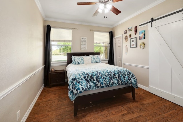 bedroom featuring a barn door, ceiling fan, ornamental molding, and dark hardwood / wood-style flooring